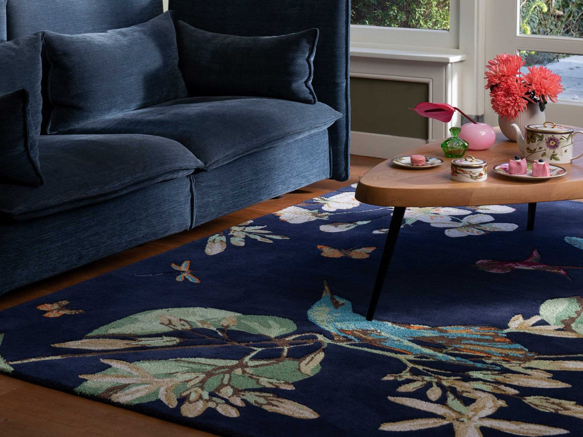 Wedgwood Hummingbird Navy 37818 rug styled in a room setting