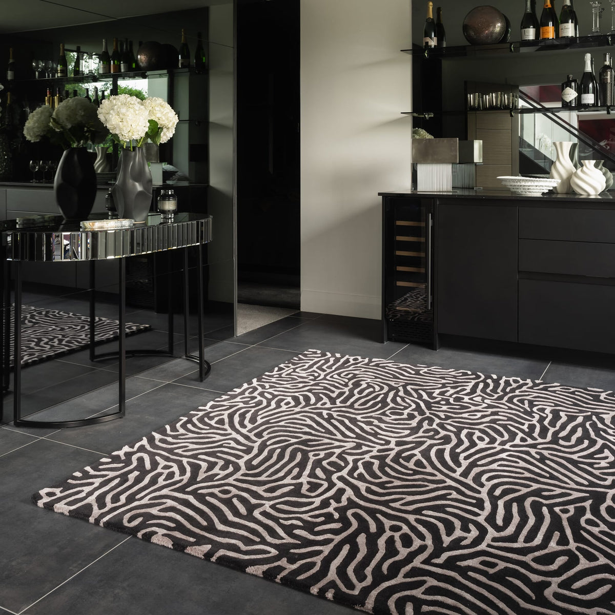 Katherine Carnaby Coral Gunmetal rug in a living room