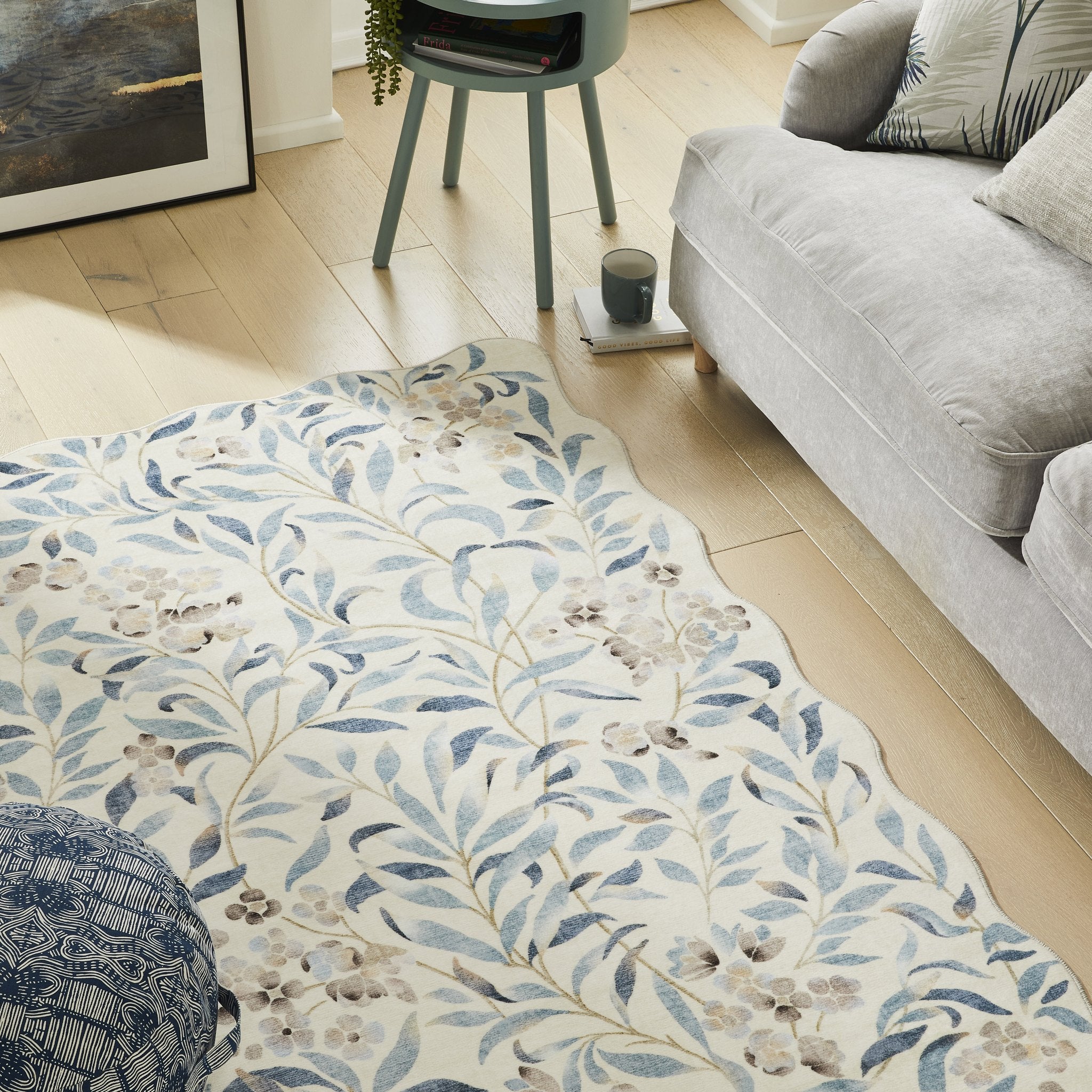 Liberty Lib 301 Ivory Blue rug styled beside a sofa