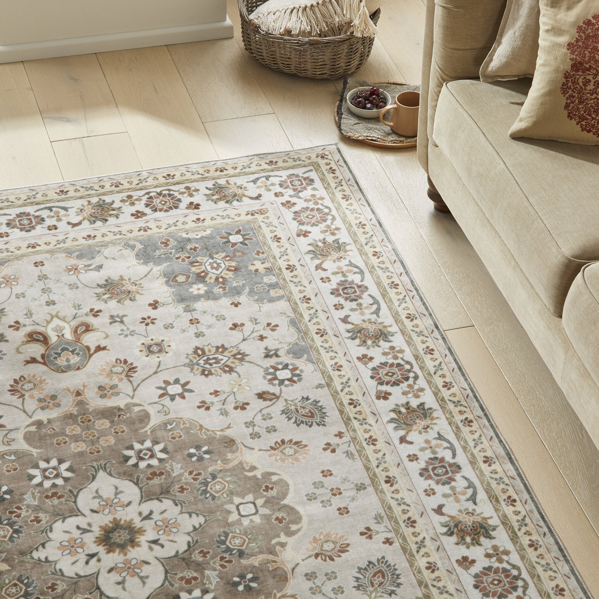 Liberty Lib 207 Mocha washable rug beside a cream sofa